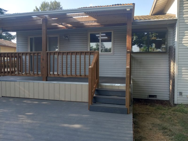 Finished composite deck with cedar railings and pergola