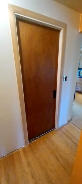 Freshly painted door and trim in clean white finish